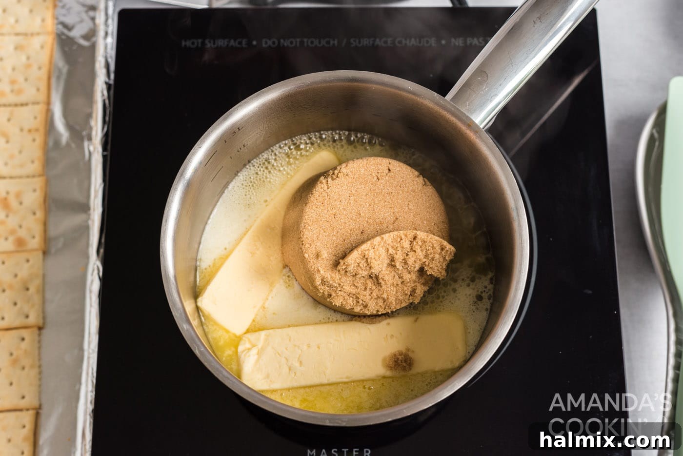 Brown sugar and butter melting together in a saucepan