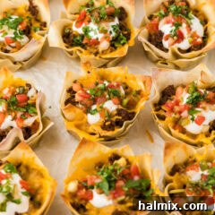 Close up photo of Taco Cups resting on parchment paper
