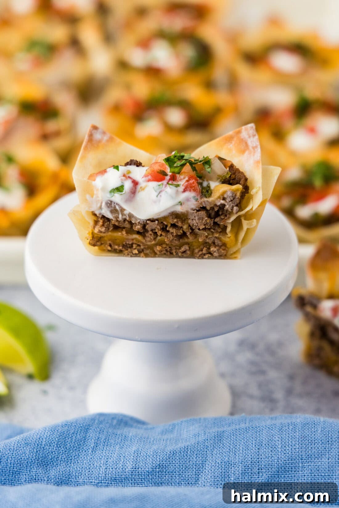 Mini Taco Bites 3 Taco Cup cut in half resting on a cupcake stand
