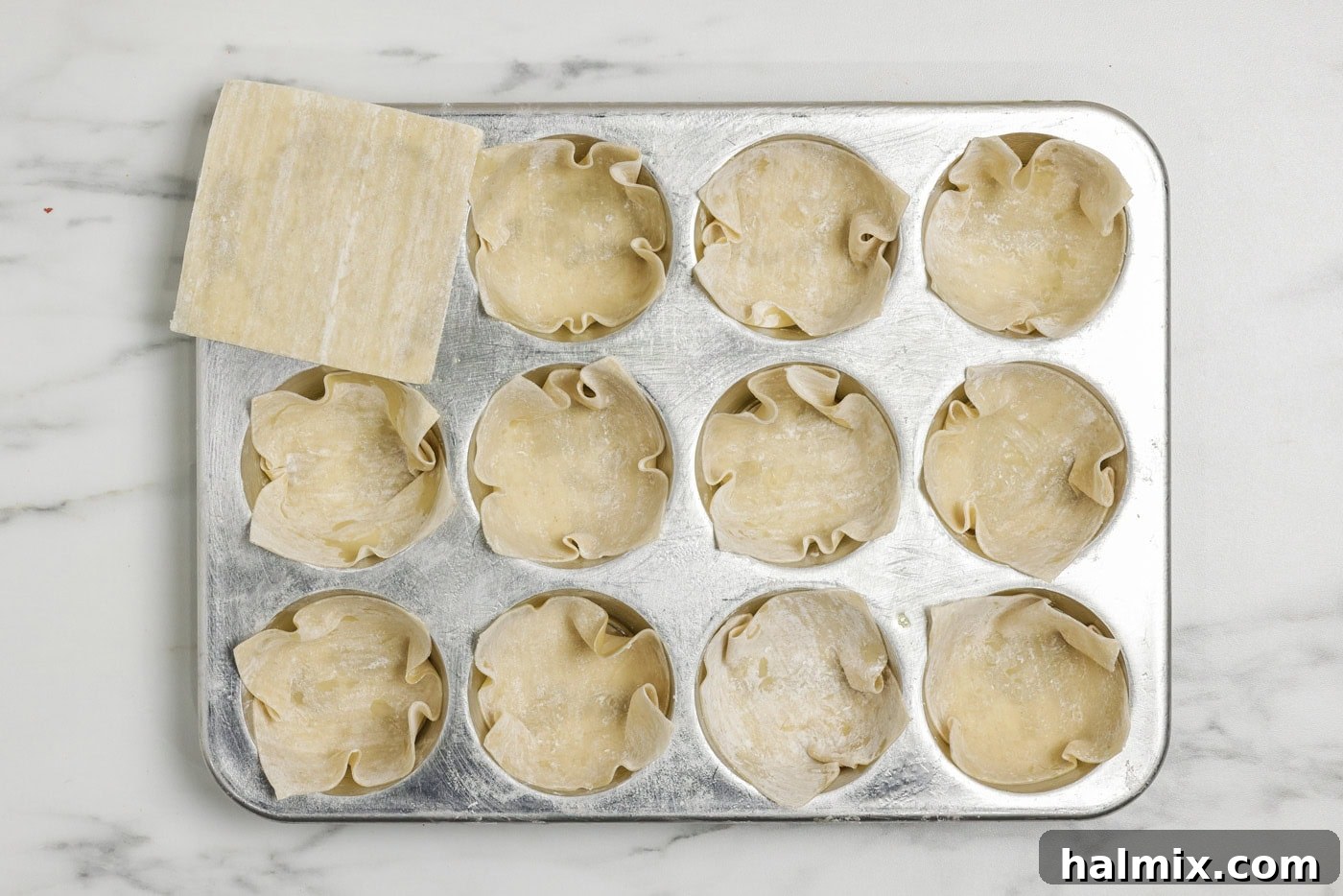 Mini Taco Bites 5 Wonton wrappers tucked inside muffin pan cavities