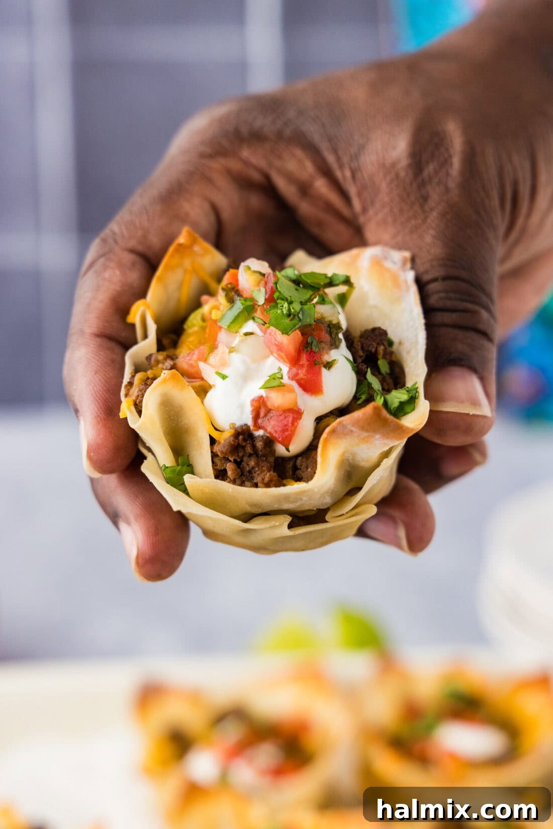 Mini Taco Bites 10 Hand holding a Taco Cup