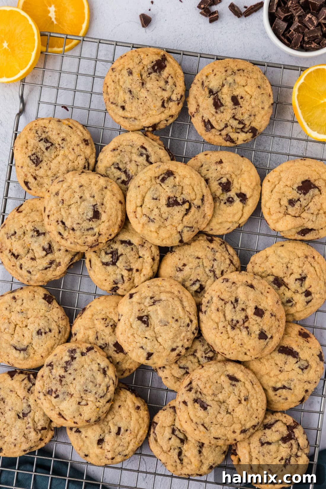 Pile of Orange Chocolate Chip Cookies on a wire rack