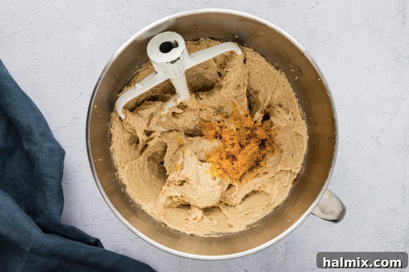 orange zest added to dough in a stand mixer bowl