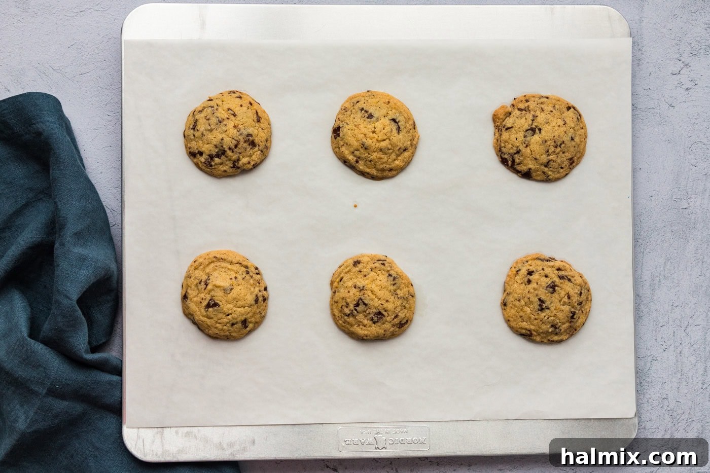 baked orange chocolate chip cookies on a baking sheet