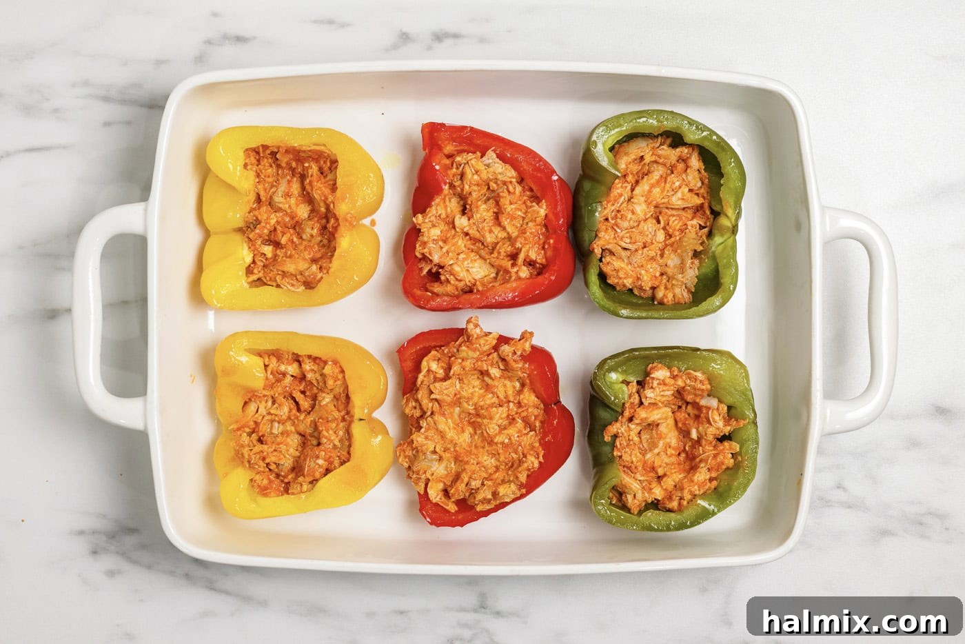 Zesty Buffalo Chicken Bell Pepper Bake 8 Buffalo chicken mixture stuffed inside bell pepper halves