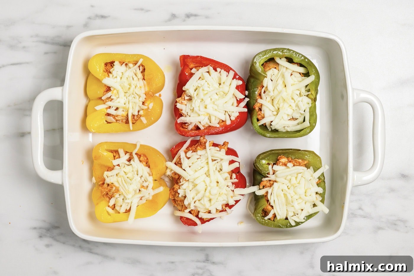 Zesty Buffalo Chicken Bell Pepper Bake 9 Shredded mozzarella cheese on top of buffalo chicken stuffed peppers