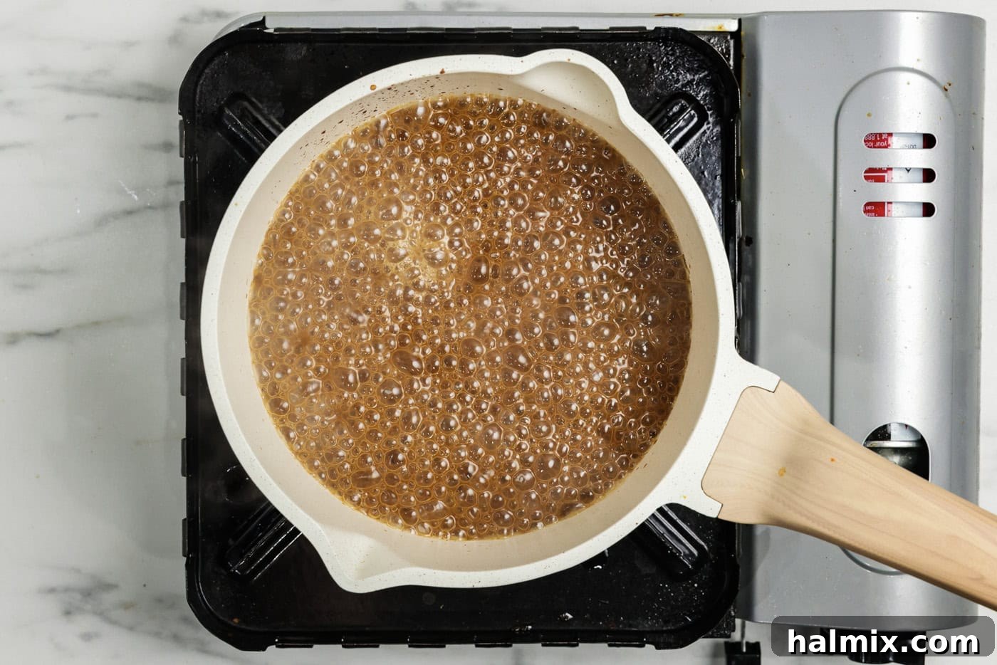 Gravy simmering in a saucepan