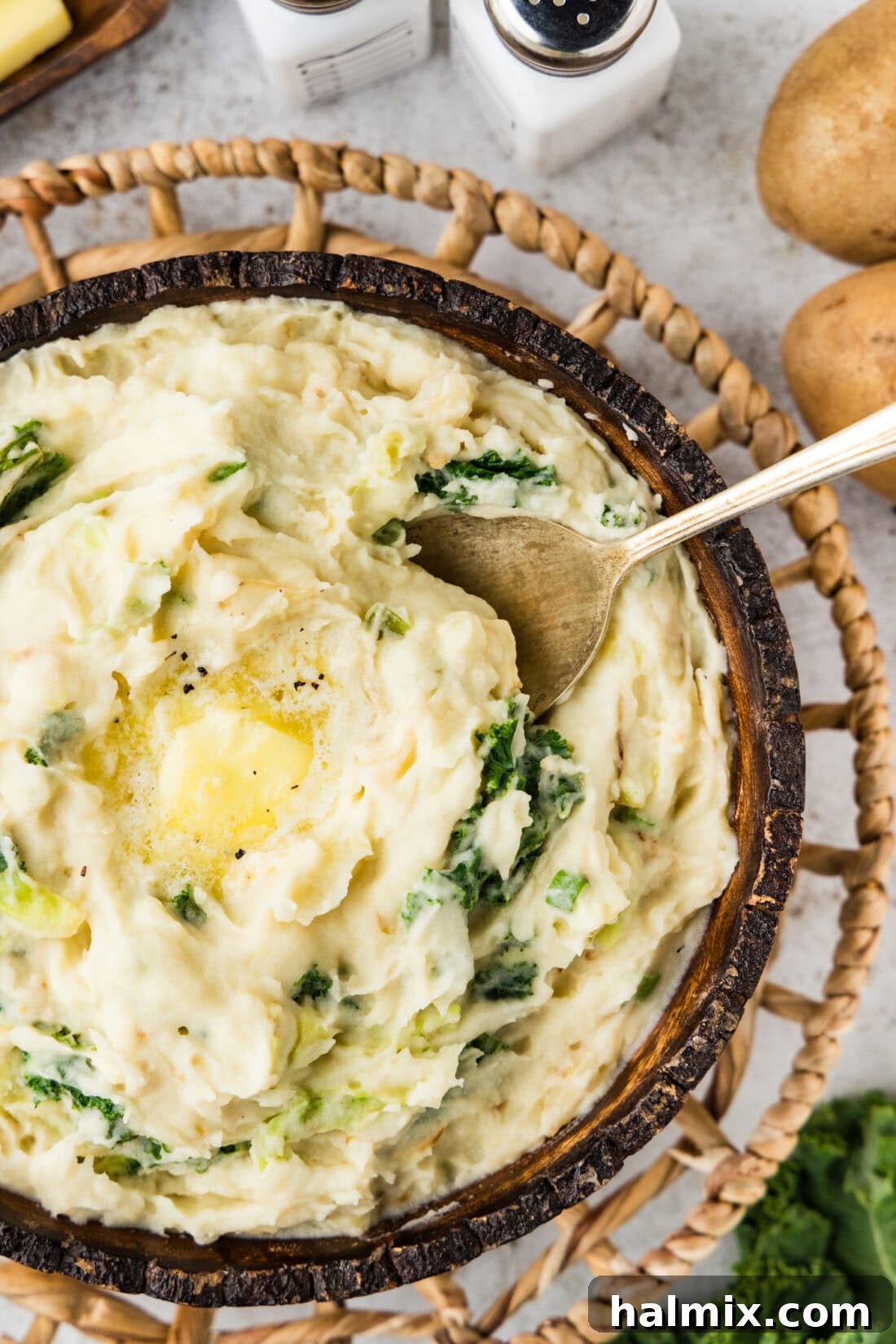 Colcannon: Ireland's Signature Mash 2 Close up photo of a bowl of creamy Colcannon (Irish Mashed Potatoes) garnished with fresh herbs
