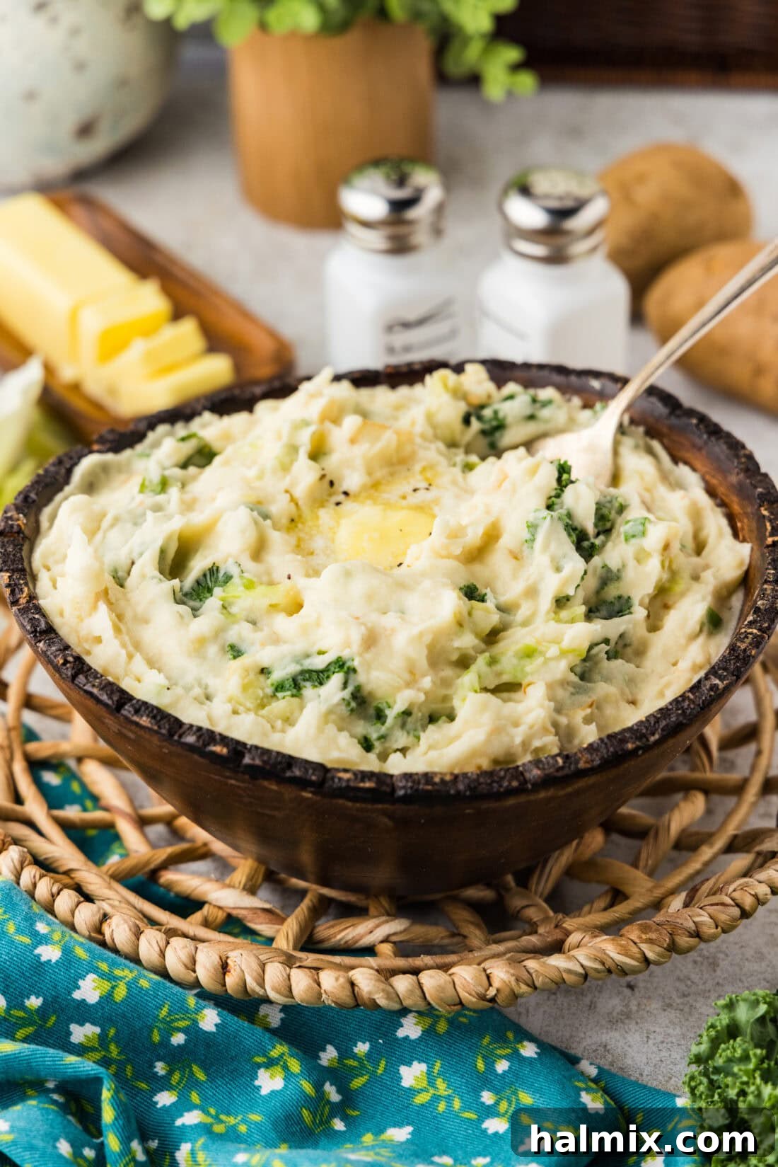 Colcannon: Ireland's Signature Mash 3 Bowl of Colcannon (Irish Mashed Potatoes) with a spoon in it, ready to be enjoyed.