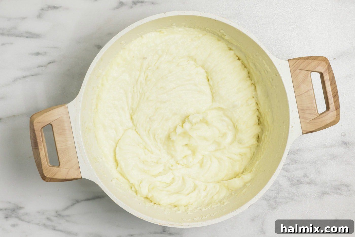 Colcannon: Ireland's Signature Mash 8 Smooth, creamy mashed potatoes with a rich texture in a pot.