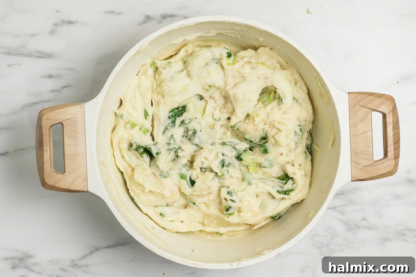 Colcannon: Ireland's Signature Mash 9 Colcannon mashed potatoes in a stockpot with cabbage and kale, fully mixed and ready to serve.