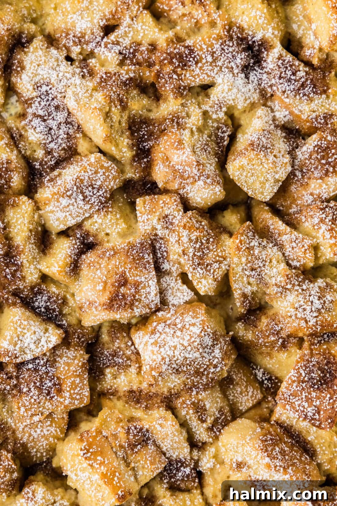 Baked French Toast Delight 11 Close up photo of French Toast Casserole in a baking dish, showcasing its golden crust