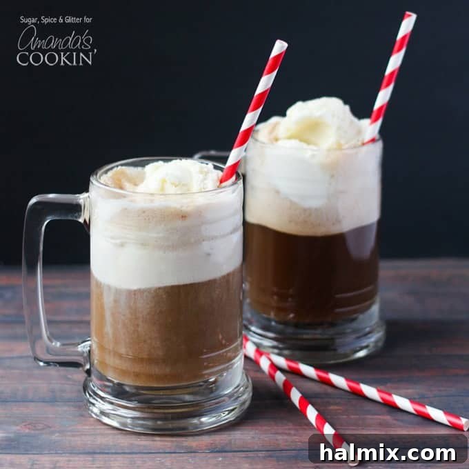 A close up photo of two root beer float cocktails in clear mugs served with red and white stripped straws, emphasizing the creamy foam and vibrant colors.