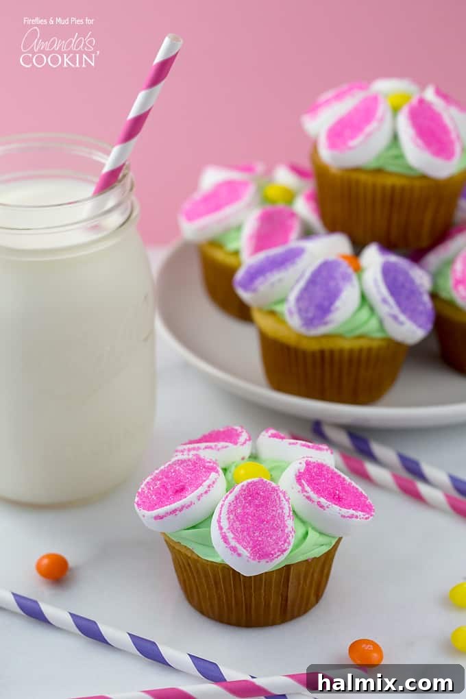 Marshmallow Blossom Cupcakes 4 A charming spread of marshmallow flower cupcakes, accompanied by a refreshing glass of milk.