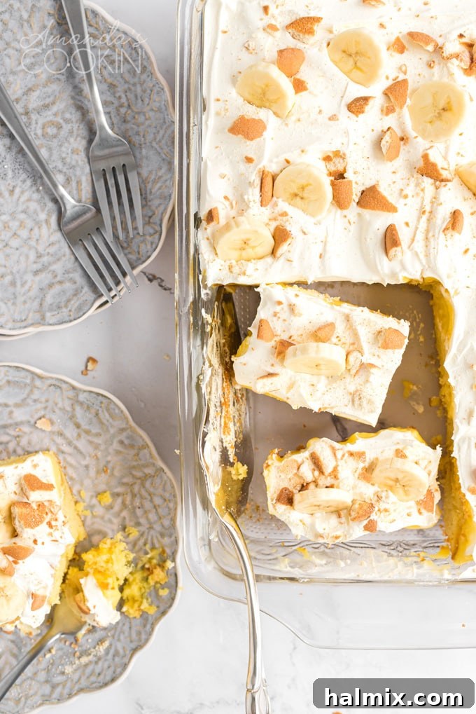 overhead view of sliced banana pudding poke cake