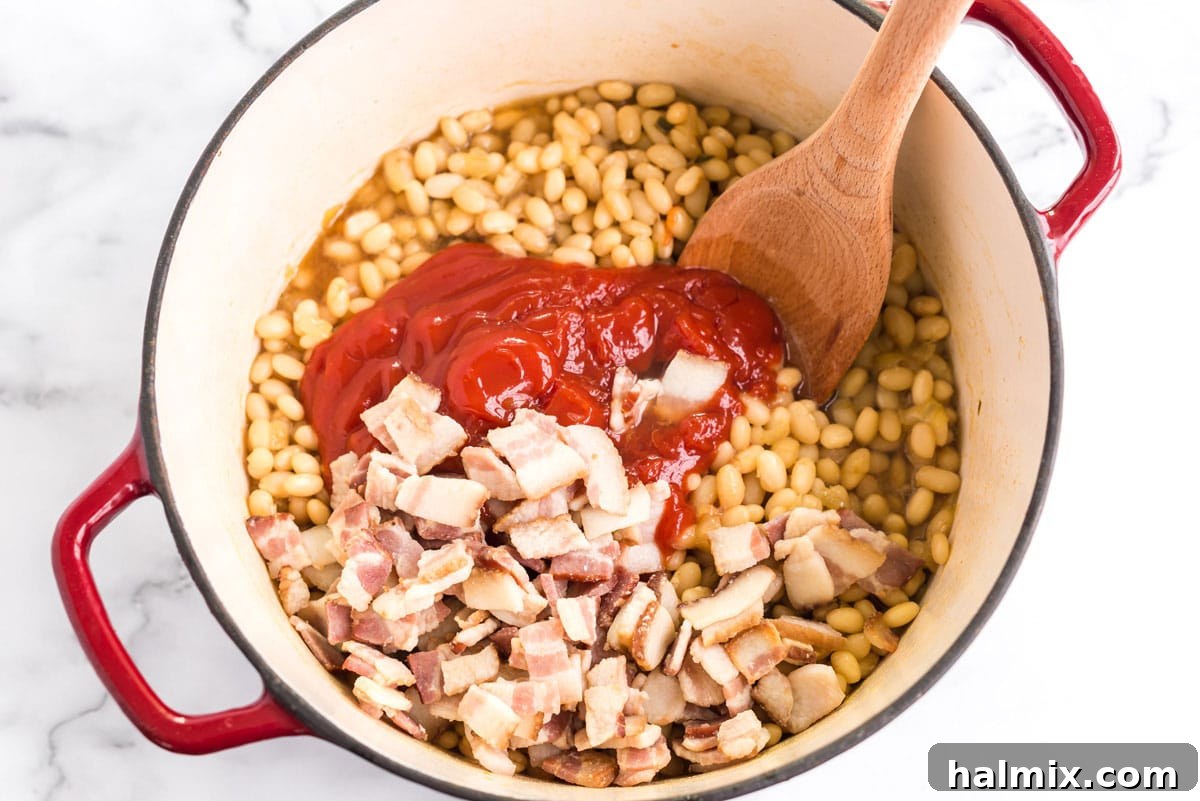 ketchup, bacon, and bean mixture in a pan