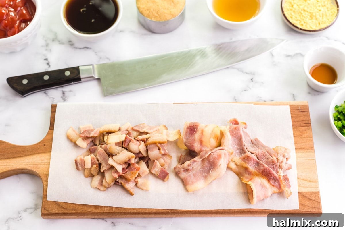 partially cooked bacon on a cutting board
