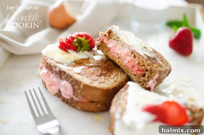 This French toast is stuffed with sweet strawberries and cream filling. Turn your usual breakfast into something amazing - Strawberry Stuffed French Toast! A piece of french toast with strawberries and cream