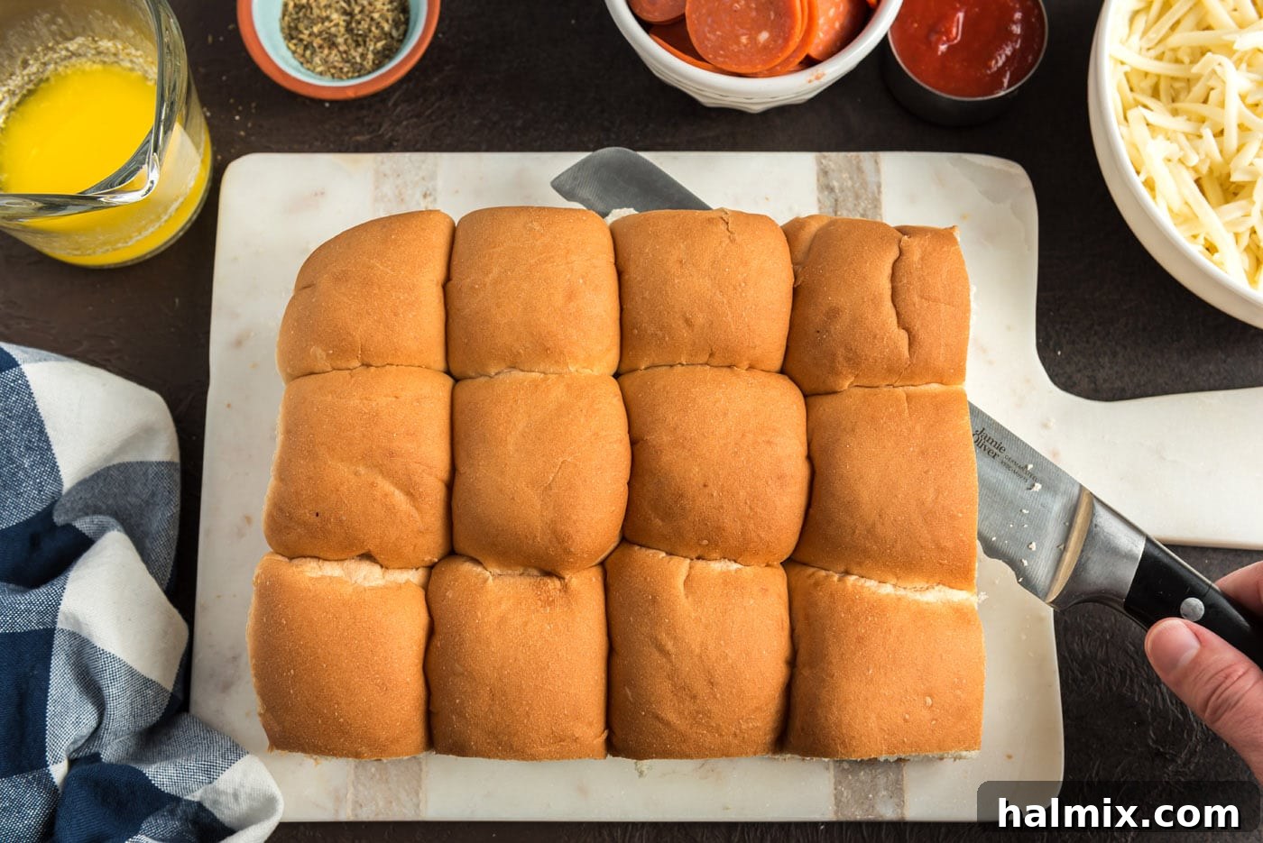 Cheesy Pizza Buns 5 slicing slider buns in half