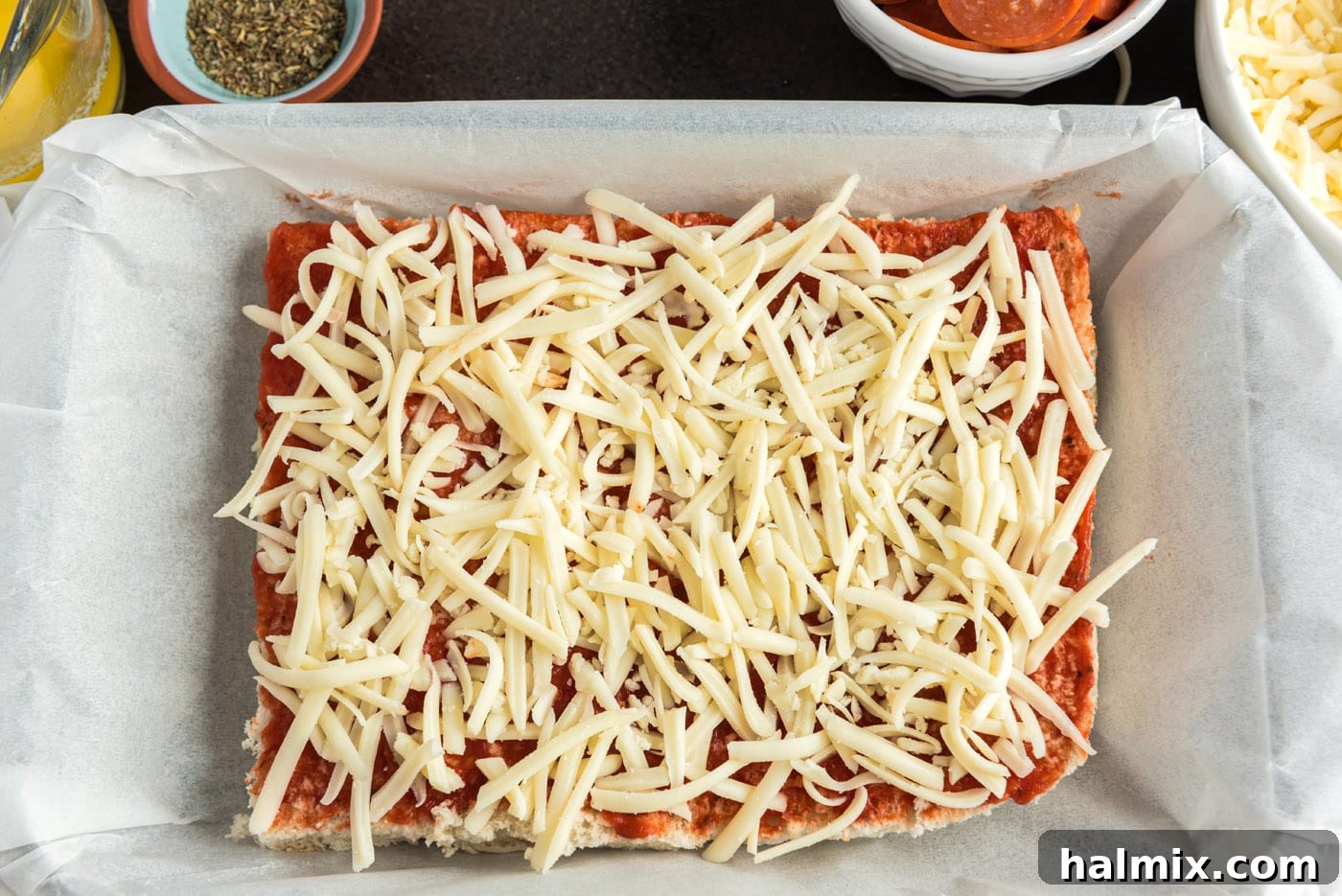 Cheesy Pizza Buns 7 shredded mozzarella cheese on top of pizza sauce