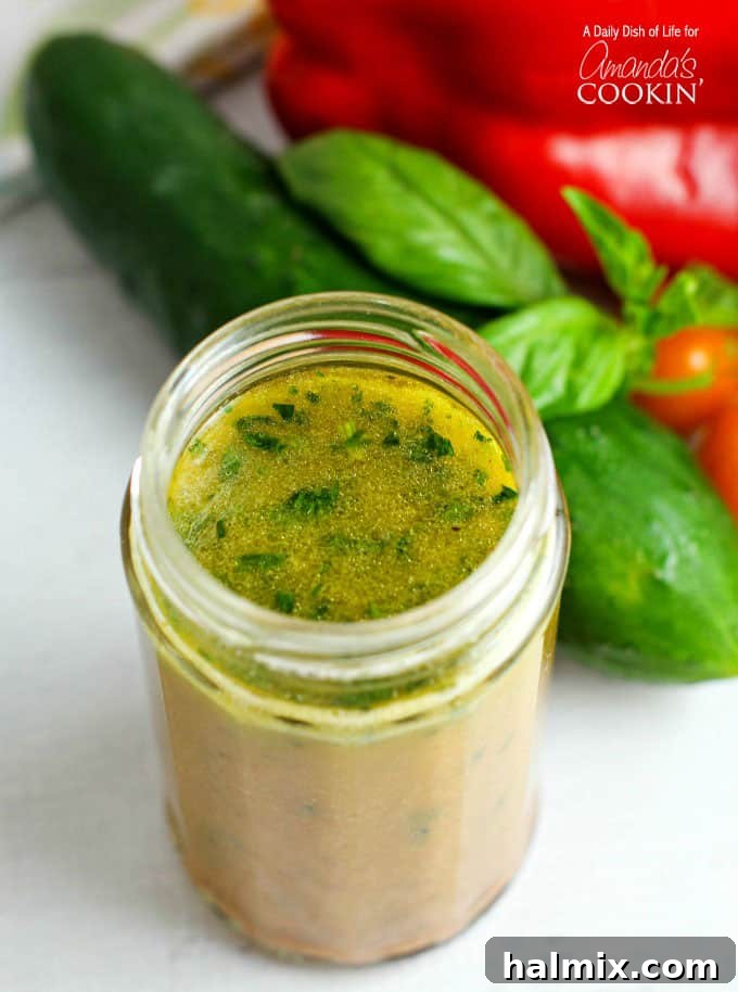 Vibrant Summer Pasta Salad 4 A jar of homemade salad dressing, ready to be poured.