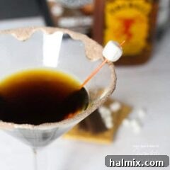 Toasted Smores Martini 7 A perfectly crafted S'mores Martini with a flaming top, ready to be enjoyed.