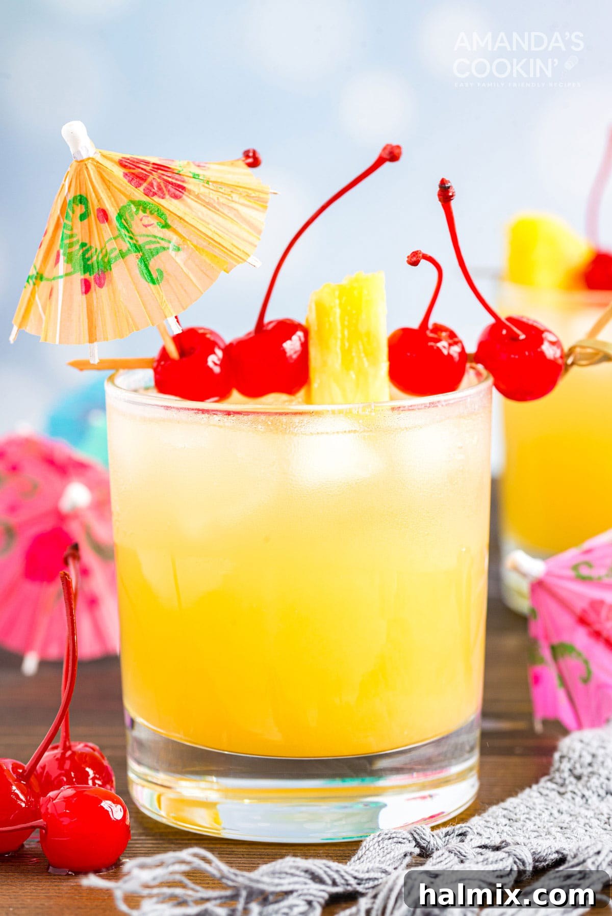 Mai Tai cocktail in a rock glass served with a cocktail umbrella