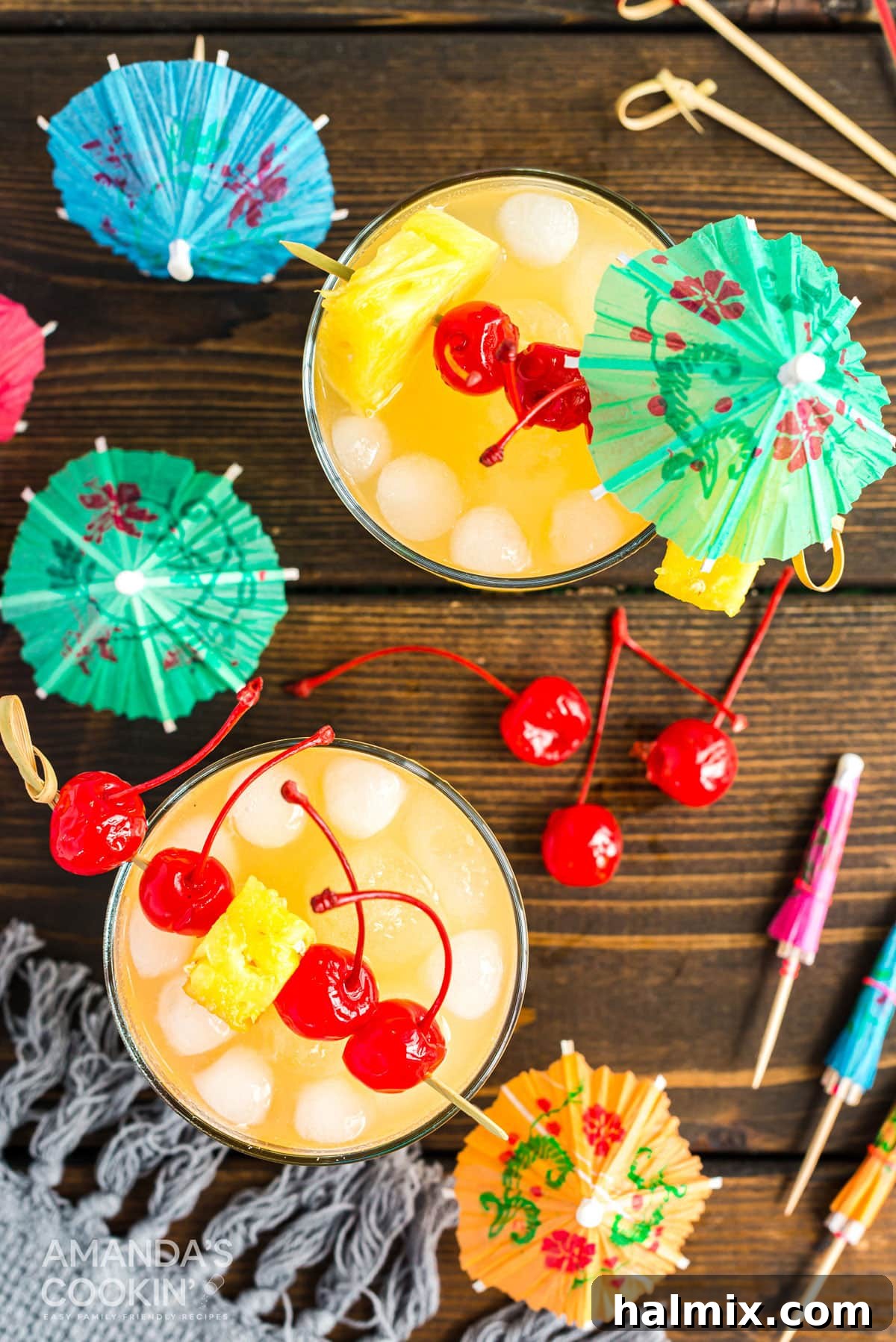 overhead photo of mai tai cocktails with cherry garnishes
