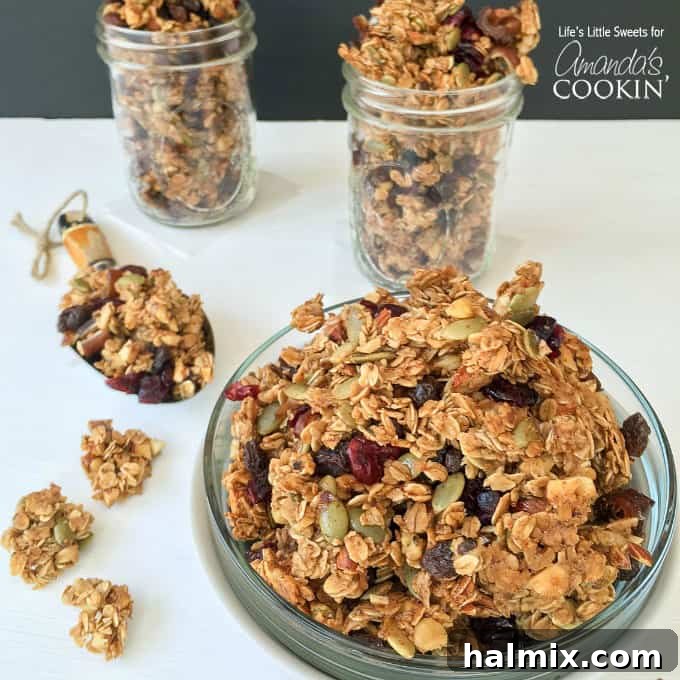 A beautifully arranged plate of autumn harvest fruit and nut granola with two full mason jars in the background, ready for gifting or storage.