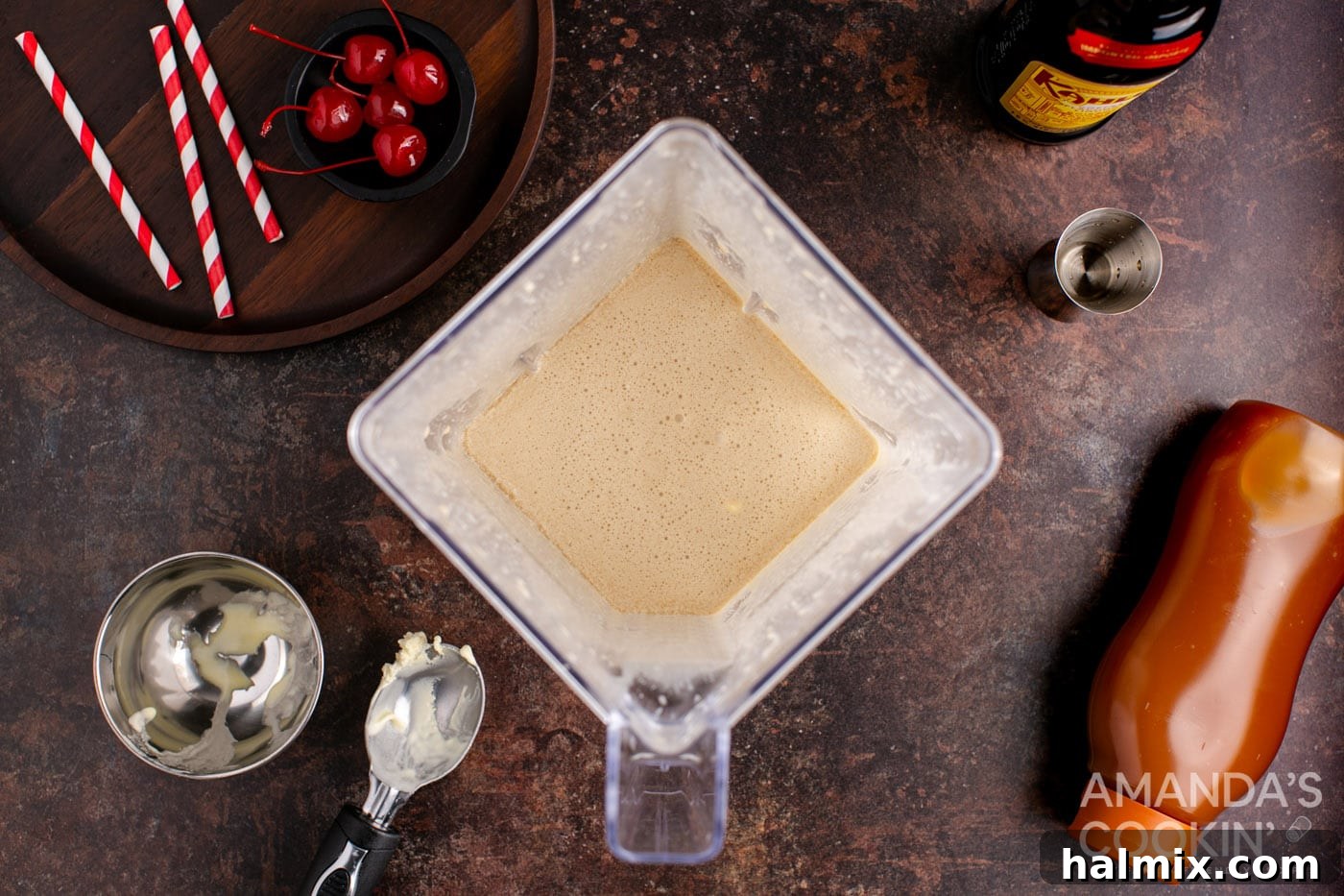 Spiked Butterscotch Shake 5 All cocktail ingredients, including butterscotch schnapps, Kahlua, and vanilla ice cream, ready to be blended in a high-speed blender.