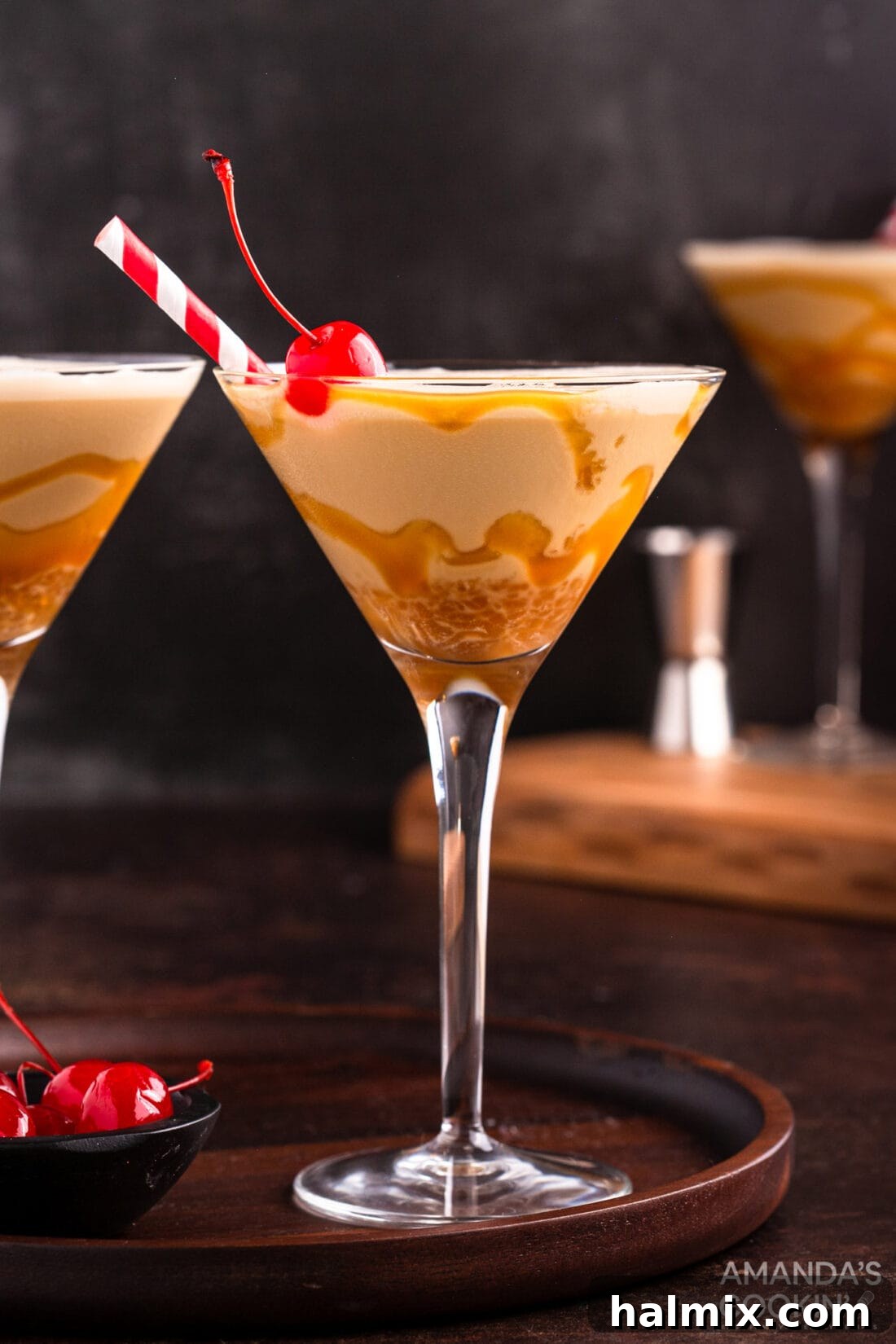 Spiked Butterscotch Shake 9 An inviting image of a butterscotch milkshake cocktail in a martini glass, ready to be enjoyed, with a maraschino cherry.