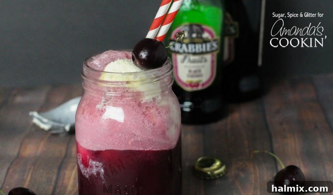 Velvet Cherry Float 5 Another enticing close-up of the Black Cherry Float Cocktail, highlighting the condensation on the mason jar, emphasizing its refreshing coolness.