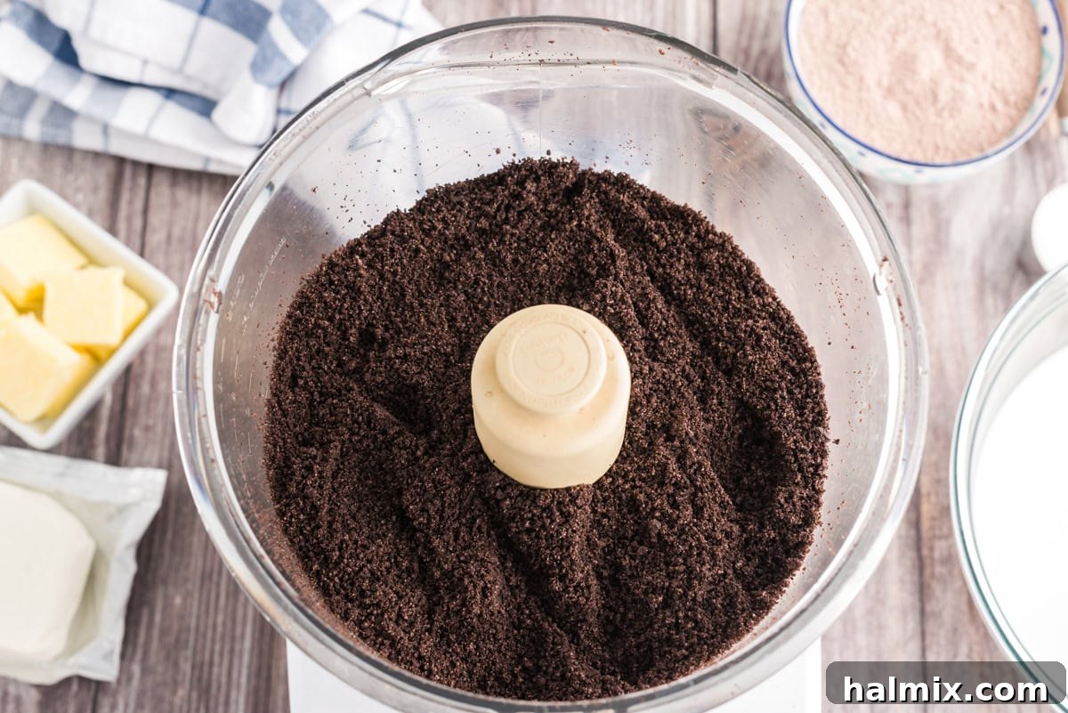Oreo cookie crumbs in a food processor