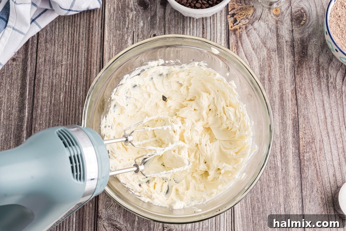Beaten cream cheese in a mixing bowl