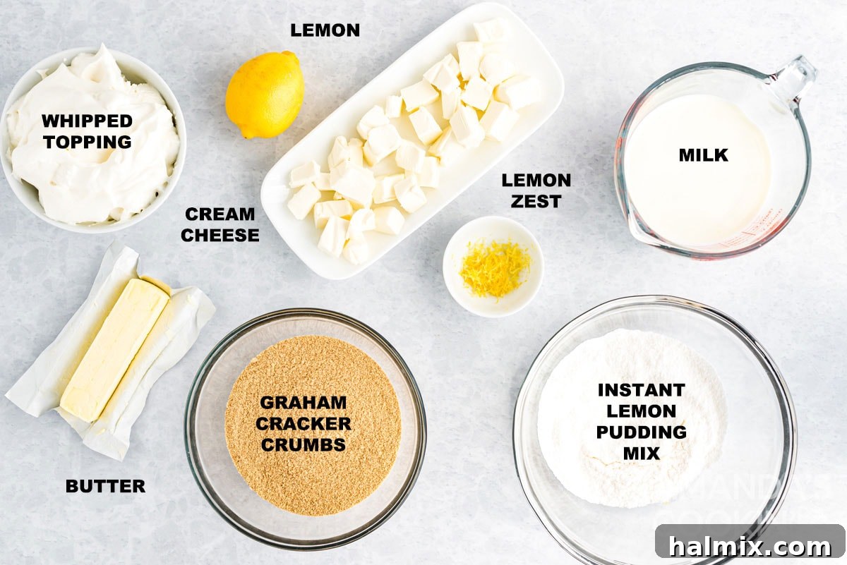 Labeled ingredients laid out for no-bake lemon cheesecake pudding dessert, including graham crackers, cream cheese, instant pudding mix, milk, butter, and Cool Whip.