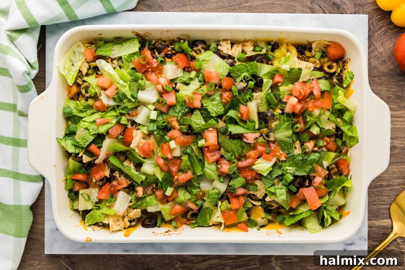 Ultimate Taco Bake 11 Shredded lettuce and chopped tomatoes added on top of baked taco casserole