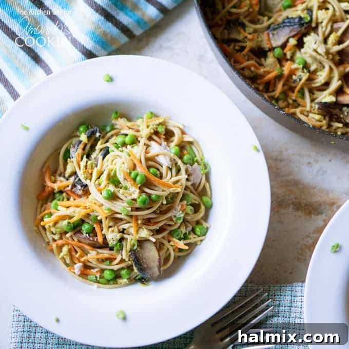 Quick and Light Tuna Noodle Skillet 3 An overhead view of a pristine white bowl generously filled with the light and healthy tuna casserole skillet.