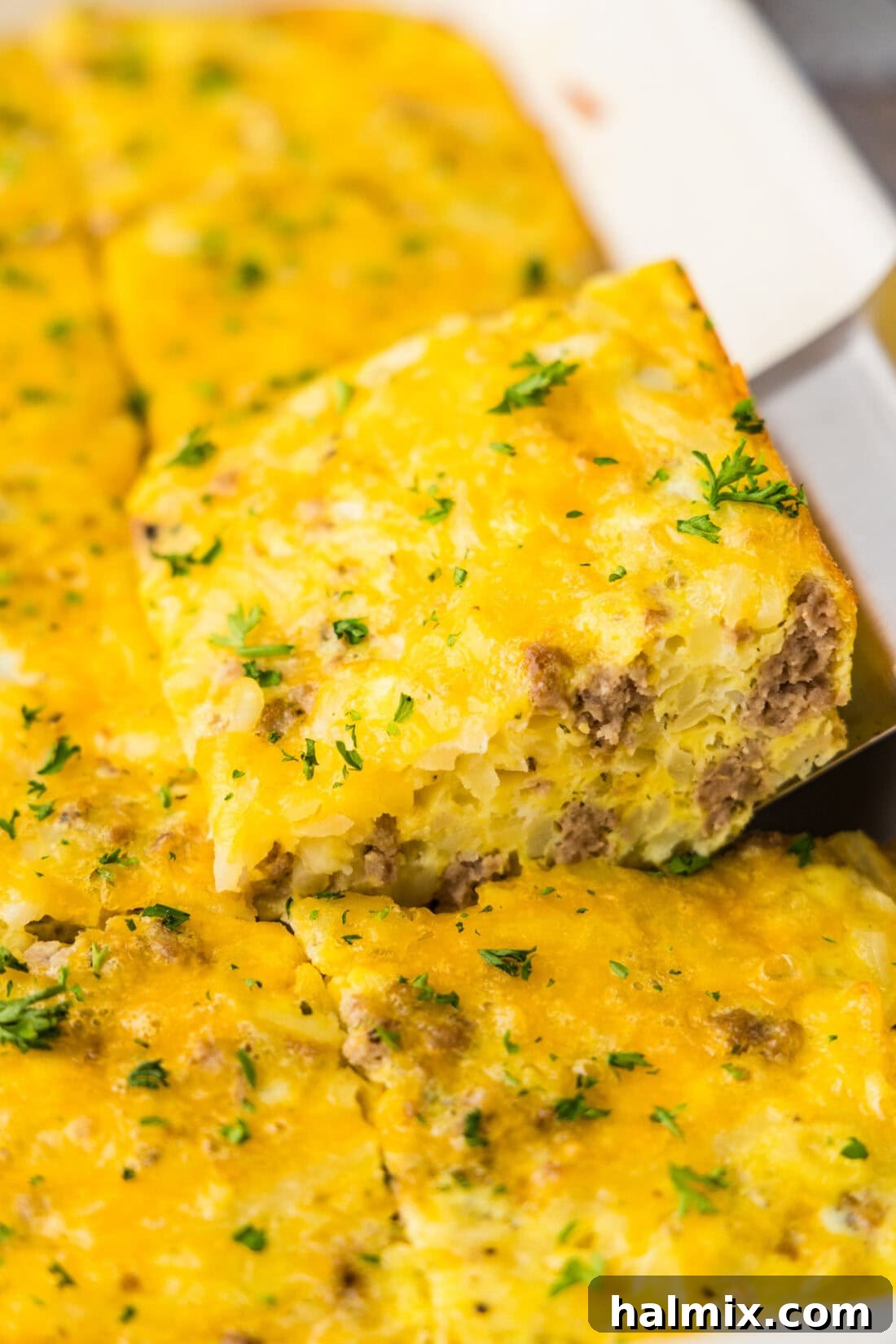 Savory Turkey Hash Brown Breakfast Bake 3 SPATULA REMOVING CASSEROLE SLICE