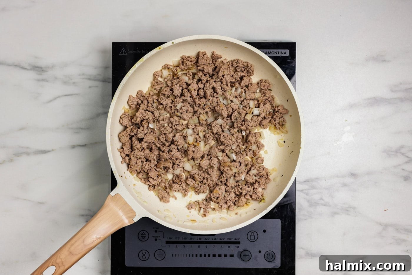 Savory Turkey Hash Brown Breakfast Bake 5 ground turkey browned in a skillet with onion