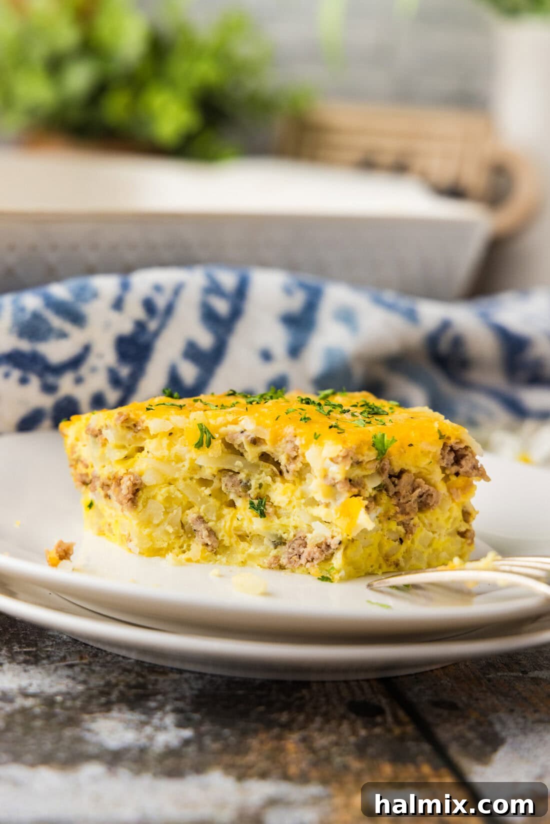 Savory Turkey Hash Brown Breakfast Bake 8 slice of Turkey Hash Brown Breakfast Casserole on white plate