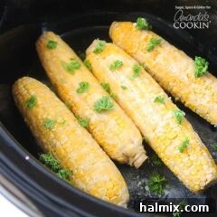 An overhead of corn on the cob in a crockpot.