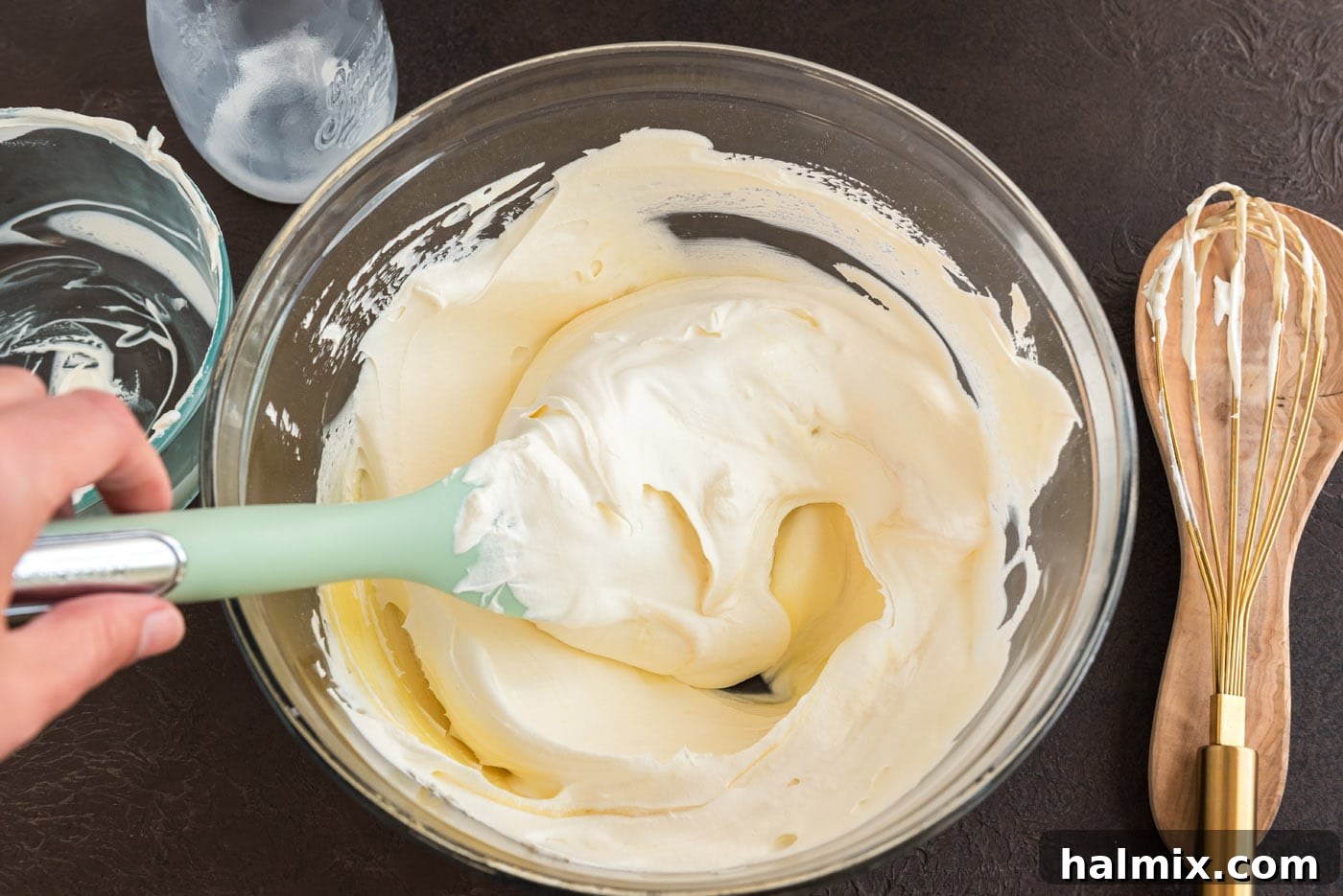 Enchanted Chocolate Pumpkin Cake 14 prepared vanilla mousse in a bowl with a rubber spatula