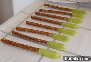 Boogers on a stick laying on parchment paper, capturing the original, simple presentation from 2005.