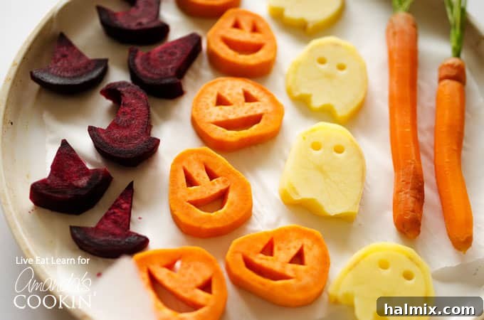 A close up photo of roasted Halloween vegetables arranged in a spooky yet appetizing manner.