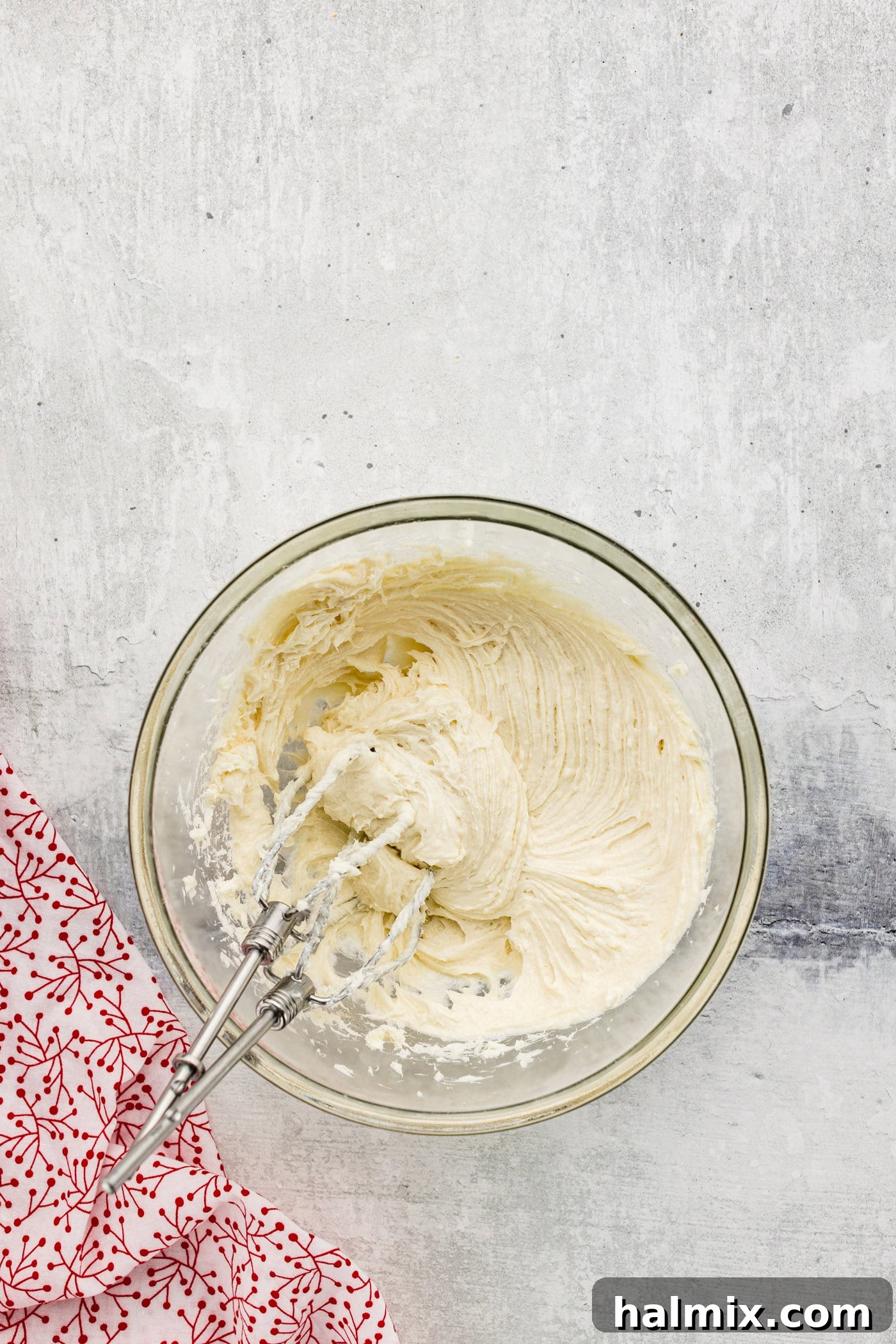cream cheese, sugar, and vanilla beaten with a hand mixer in a bowl