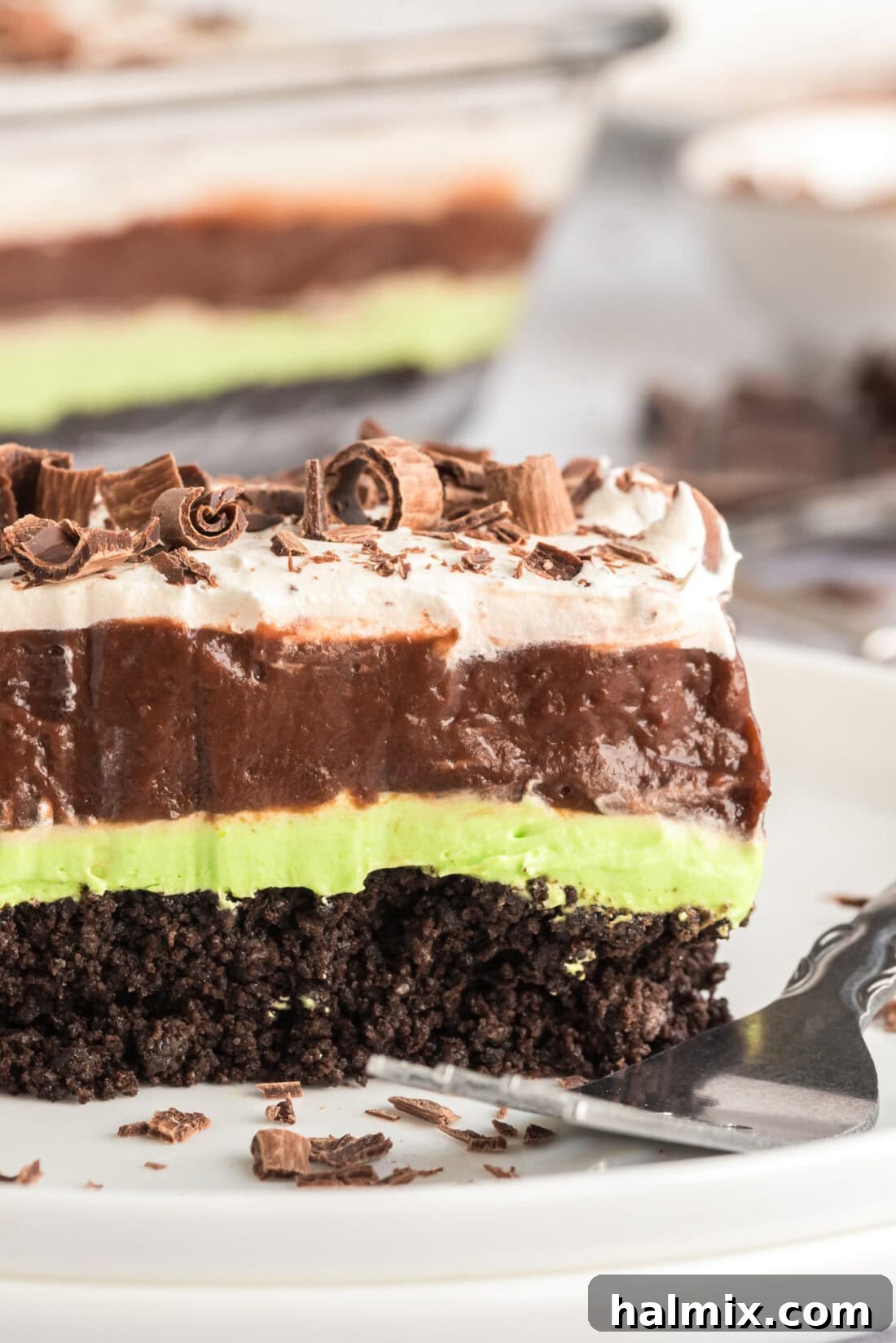 Invigorating Mint Chocolate Lasagna 12 Close up photo of a perfectly layered slice of Mint Chocolate Lasagna on a plate