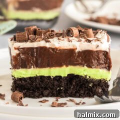 Slice of Mint Chocolate Lasagna on a plate, garnished with chocolate shavings