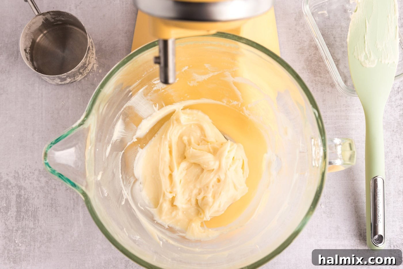 Invigorating Mint Chocolate Lasagna 7 Cream cheese, powdered sugar, and peppermint extract being beaten in a mixer bowl