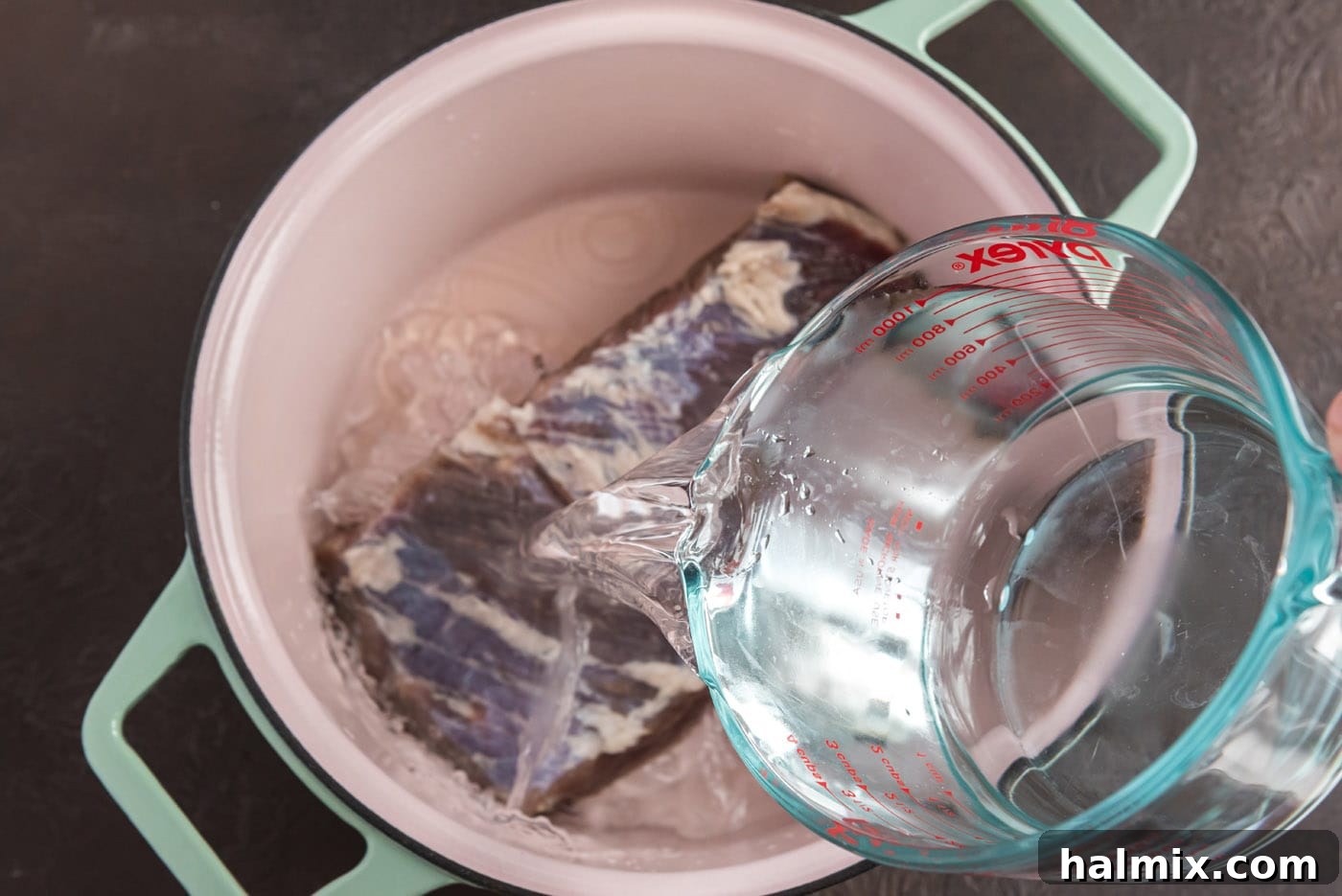 pouring water over brined corned beef