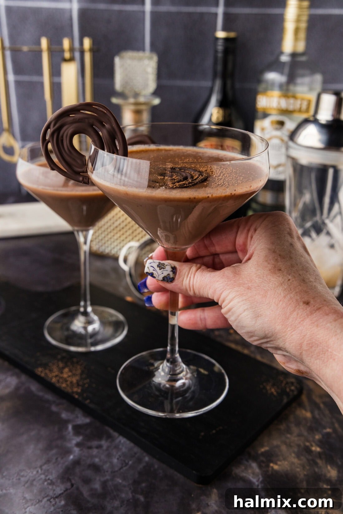Hand holding up a Baileys Chocolate Martini
